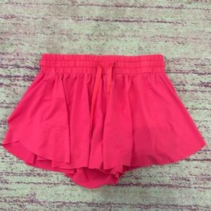 Hot pink, flowy, built in booty shorts, waistband is adjustable